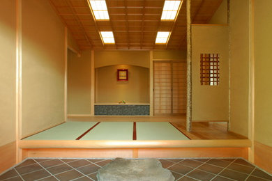 This is an example of a world-inspired entrance in Other with tatami flooring.