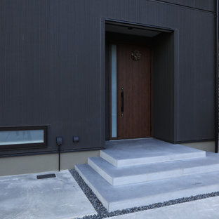 Idee per un portico minimalista di medie dimensioni e davanti casa con pavimentazioni in cemento