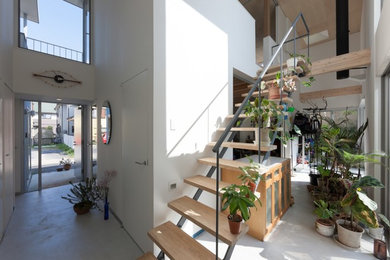 Design ideas for a world-inspired wood straight staircase in Tokyo with open risers.