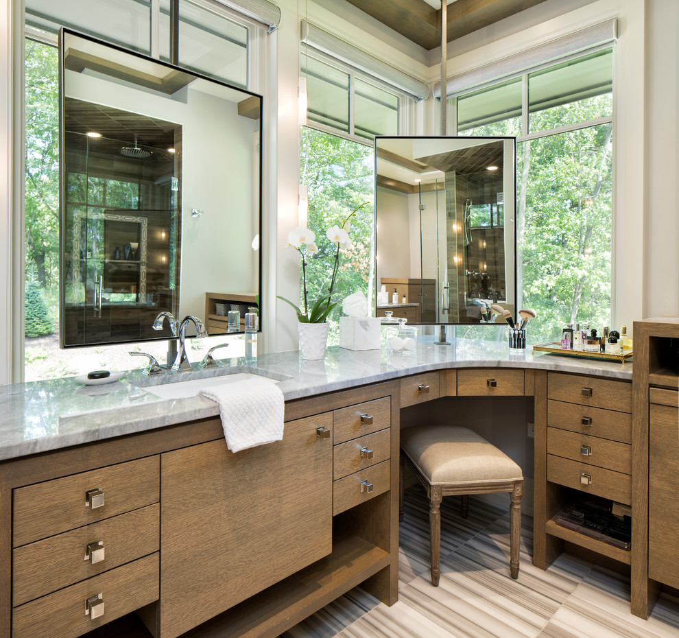 This is an example of a country master bathroom in Minneapolis with medium wood cabinets, an undermount sink, multi-coloured floor, grey benchtops and flat-panel cabinets.