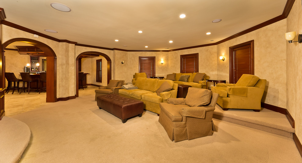 Inspiration for an expansive traditional walk-out basement in DC Metro with beige walls and carpet.