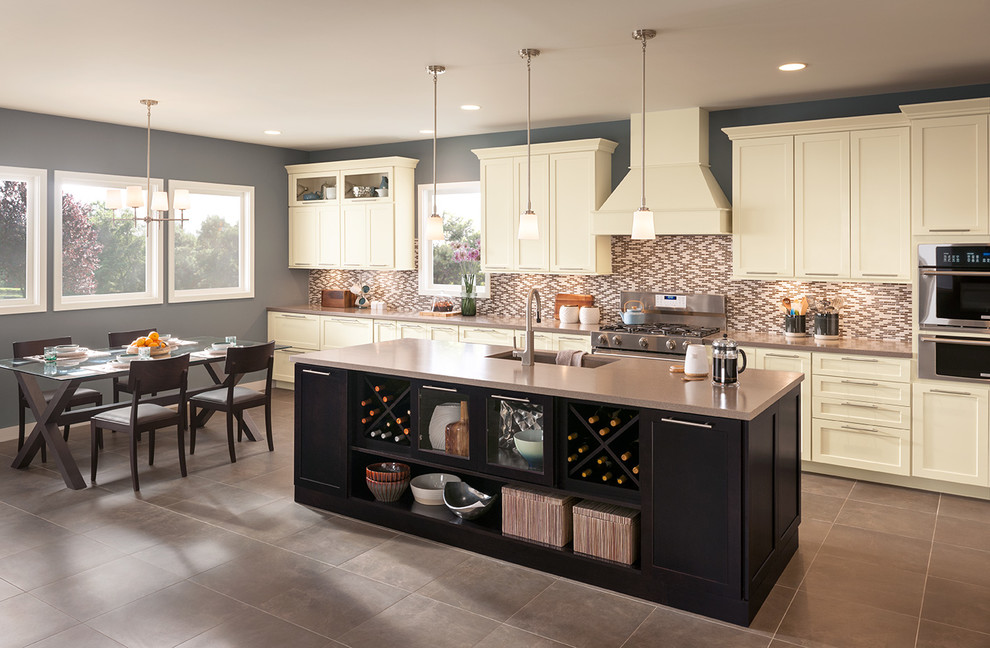 Kitchen - transitional single-wall ceramic tile kitchen idea in DC Metro with an undermount sink, shaker cabinets, dark wood cabinets, quartz countertops, beige backsplash, mosaic tile backsplash, stainless steel appliances and an island