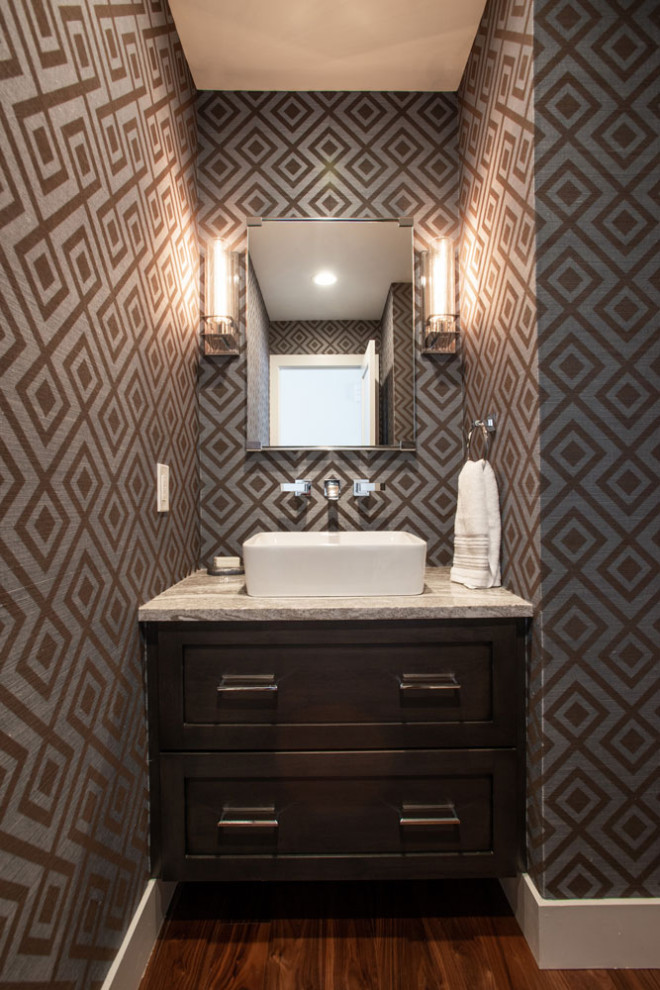 This is an example of a mid-sized contemporary powder room in Other with a console sink and a built-in vanity.