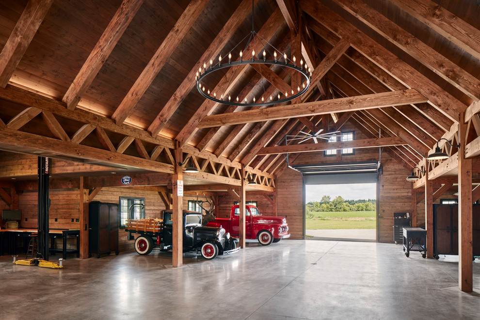 Inspiration for a country four-car garage in Milwaukee.