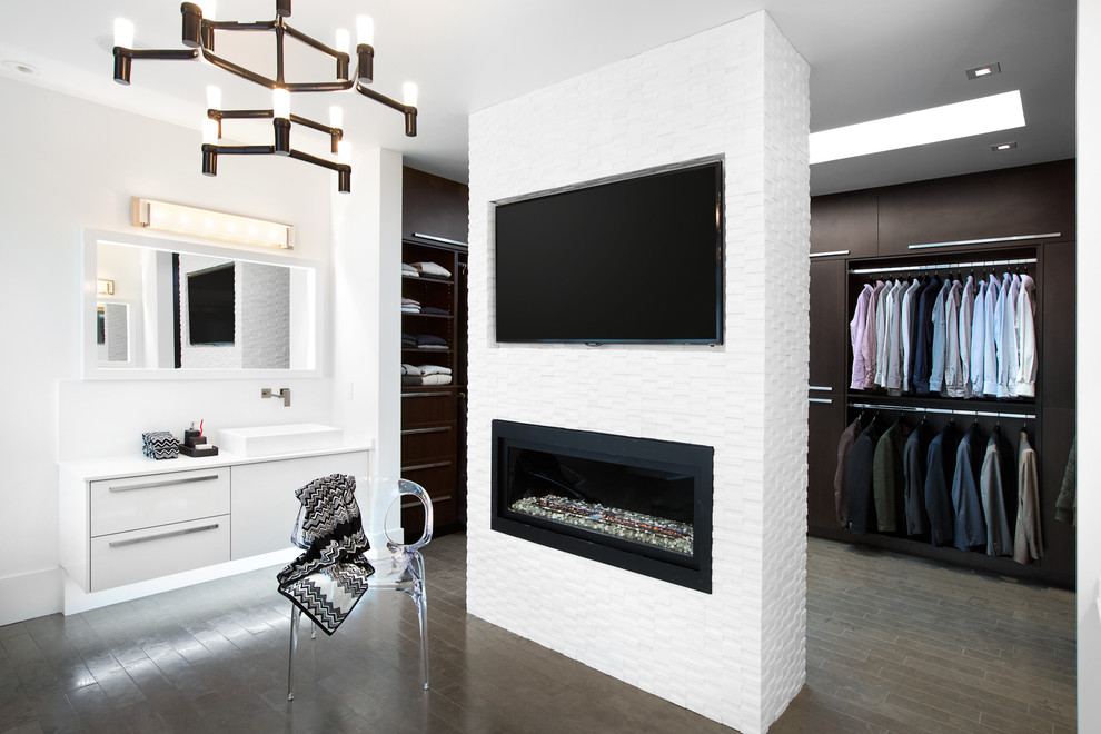 Large contemporary men's dressing room in Vancouver with flat-panel cabinets and dark wood cabinets.