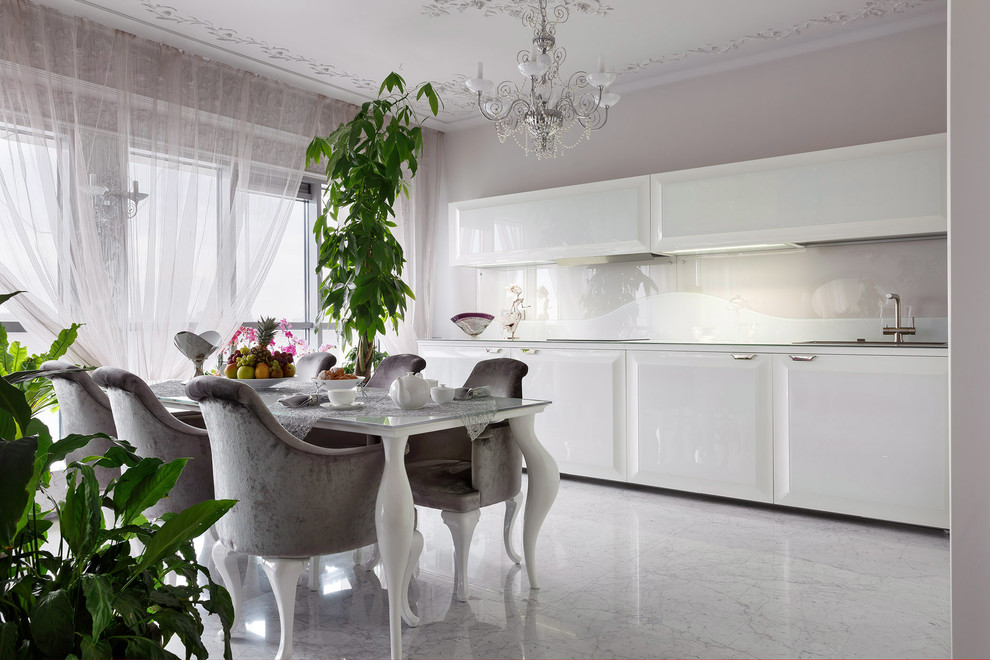Inspiration for a large traditional l-shaped open plan kitchen in Saint Petersburg with raised-panel cabinets, white cabinets, glass benchtops, white splashback, glass sheet splashback, marble floors and no island.