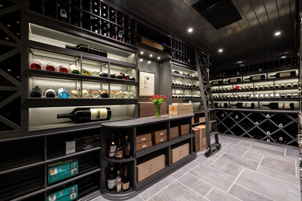Inspiration for a large traditional wine cellar in Atlanta with slate floors, diamond bins and grey floor.