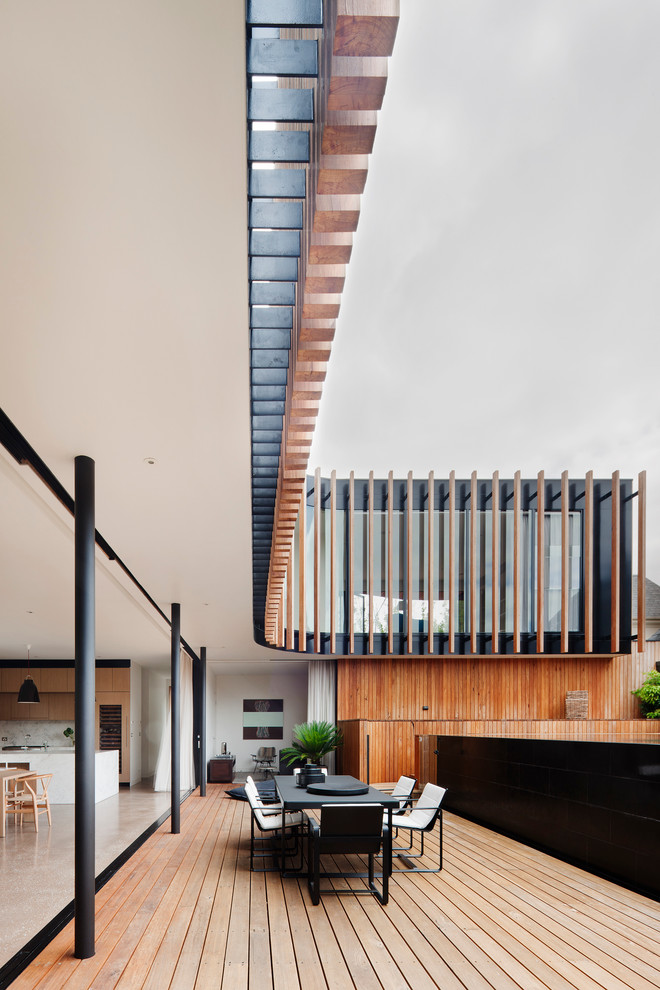 Inspiration for an expansive contemporary deck in Melbourne with a roof extension.