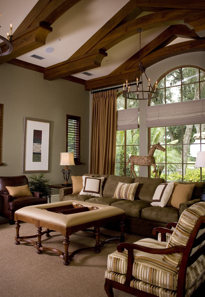 Inspiration for a traditional family room in Orlando with beige walls and carpet.