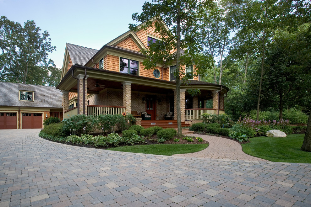 Design ideas for a large arts and crafts courtyard shaded driveway for spring in Chicago with concrete pavers.