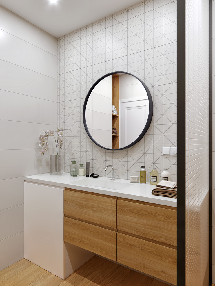 Design ideas for a small contemporary bathroom in Valencia with flat-panel cabinets, light wood cabinets, white tile, porcelain tile, white walls, solid surface benchtops, beige floor, white benchtops and an integrated sink.