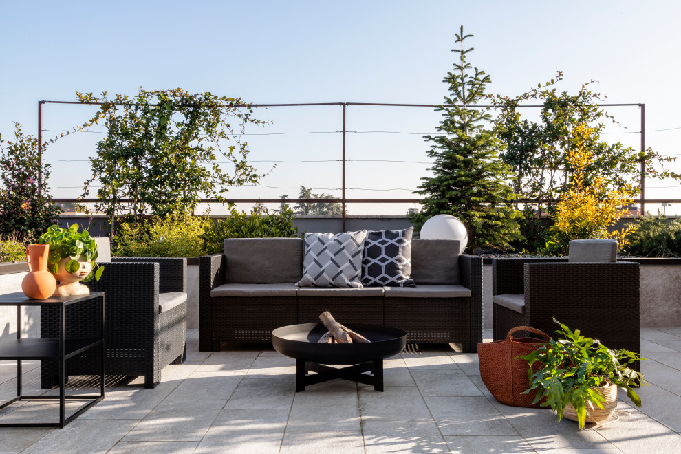 Photo of a large contemporary rooftop deck in Milan with a container garden.