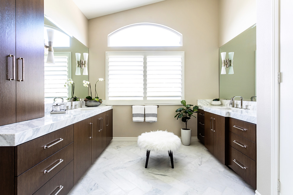 Photo of a mid-sized transitional master bathroom in Los Angeles with flat-panel cabinets, brown cabinets, a double shower, white tile, marble, marble floors, an undermount sink, marble benchtops, white floor, a hinged shower door and white benchtops.