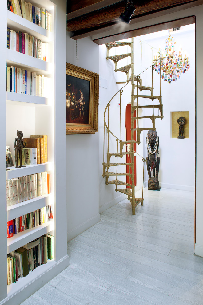 This is an example of a mid-sized mediterranean spiral staircase in Rome with open risers.