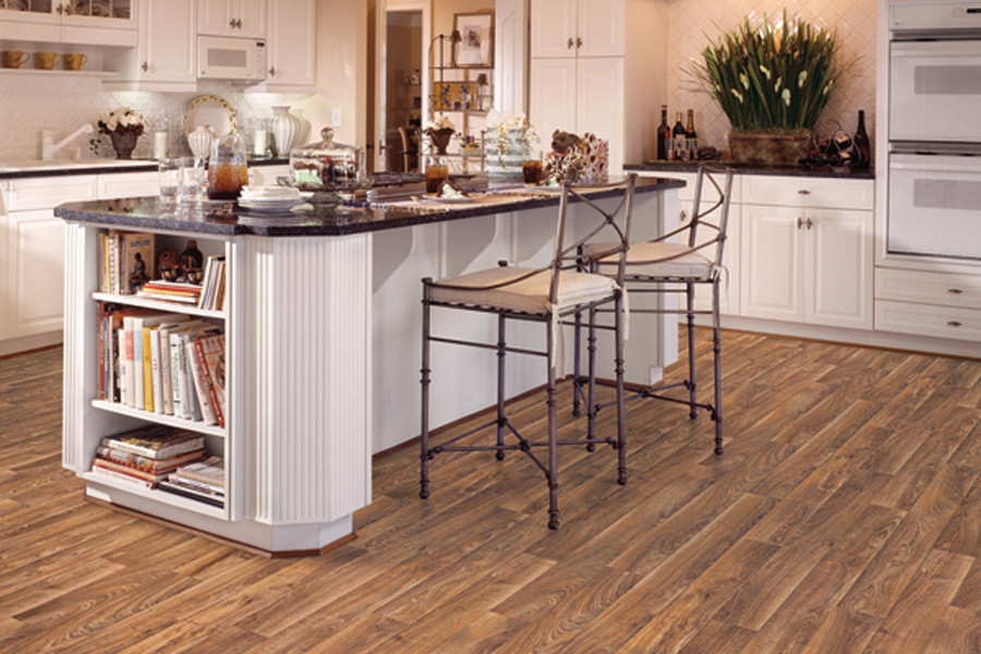 Example of a large country l-shaped vinyl floor kitchen design in Indianapolis with a drop-in sink, raised-panel cabinets, white cabinets, white appliances and an island