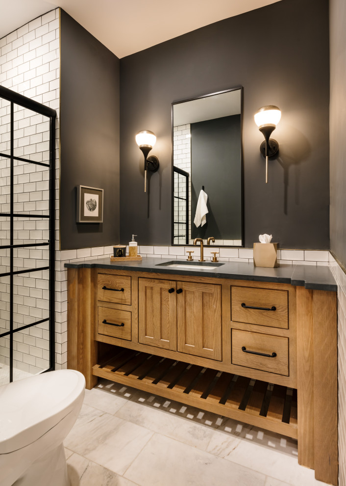This is an example of a small contemporary bathroom in Philadelphia with light wood cabinets, a double shower, a bidet, white tile, ceramic tile, grey walls, porcelain floors, an undermount sink, soapstone benchtops, white floor, a hinged shower door, grey benchtops, a niche, a single vanity and a built-in vanity.