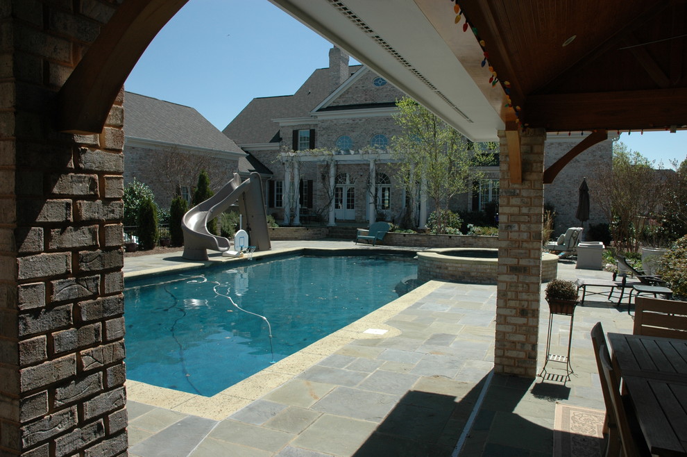 Example of a transitional home design design in Charlotte