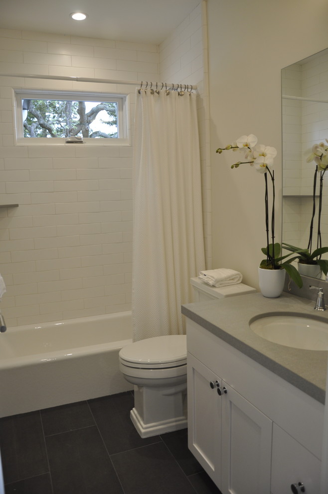 Photo of a large traditional master bathroom in San Francisco with a corner shower, white walls and marble floors.