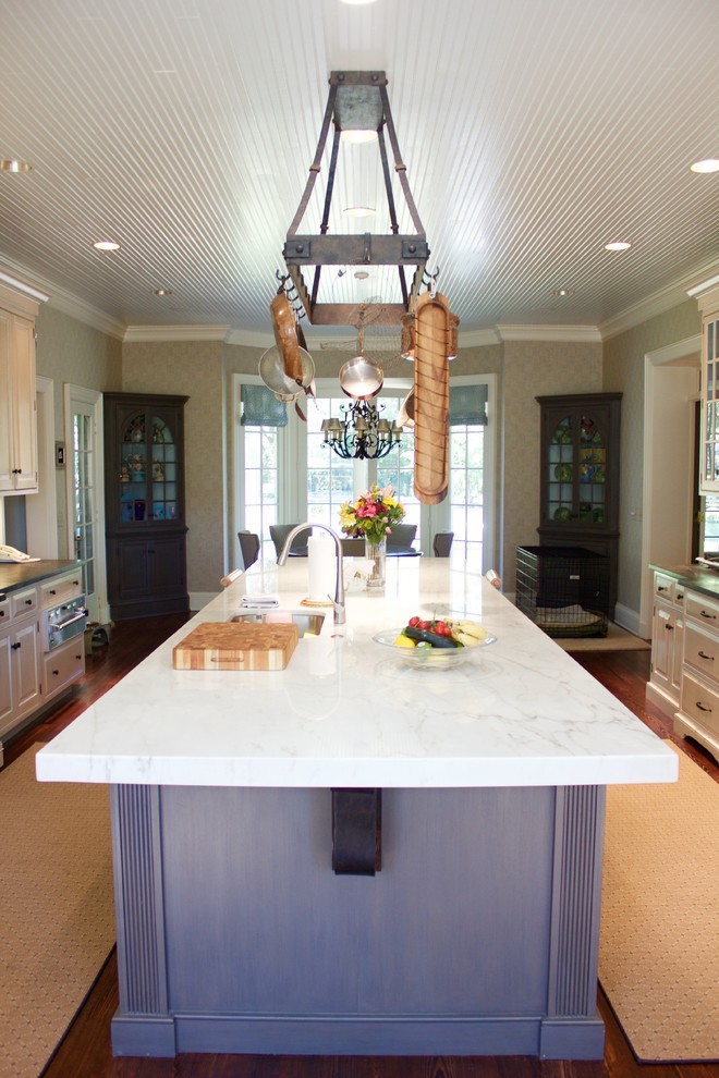 Inspiration for a large transitional dark wood floor eat-in kitchen remodel in DC Metro with marble countertops, an island, white cabinets, white backsplash and stainless steel appliances