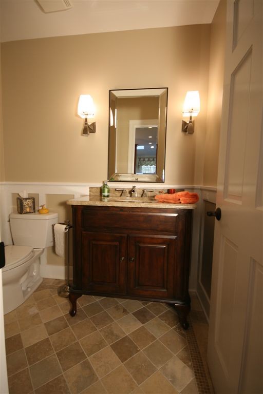 Design ideas for a traditional powder room in Chicago with furniture-like cabinets.