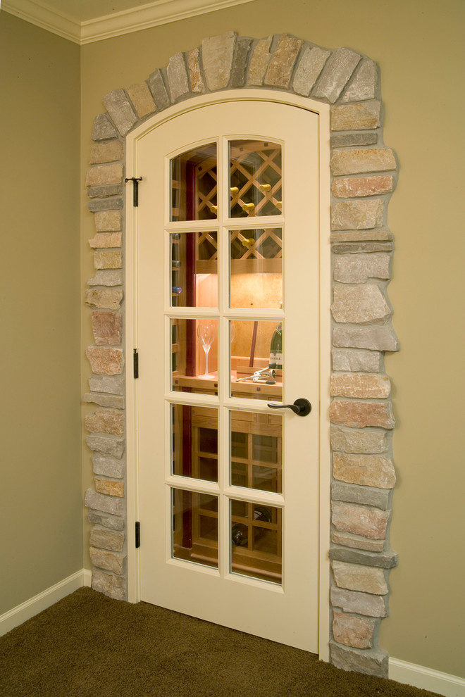 Design ideas for a small traditional wine cellar in Minneapolis with carpet and storage racks.