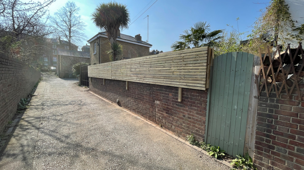 Ivy removal and privacy screen installation