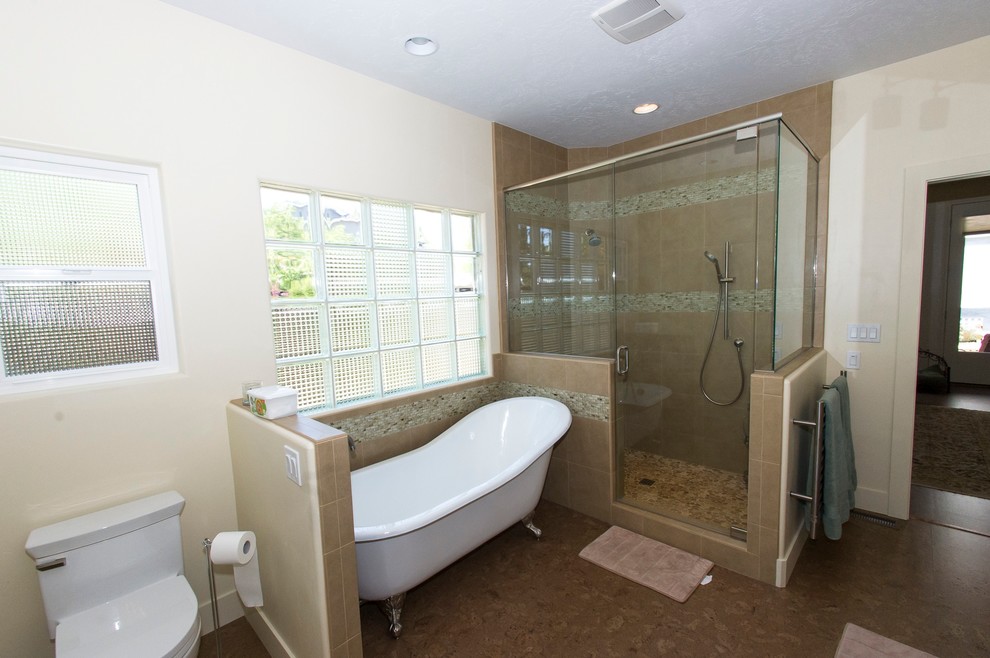 Inspiration for a large contemporary master bathroom in Boise with an undermount sink, flat-panel cabinets, brown cabinets, granite benchtops, a claw-foot tub, a corner shower, a two-piece toilet, multi-coloured tile, white walls, cork floors and ceramic tile.