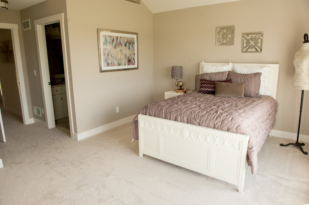Photo of a large transitional guest bedroom in Milwaukee with beige walls, carpet, no fireplace and beige floor.