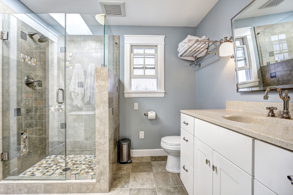 Mid-sized contemporary 3/4 bathroom in Los Angeles with flat-panel cabinets, white cabinets, an alcove shower, a one-piece toilet, brown tile, ceramic tile, purple walls, ceramic floors, an integrated sink, engineered quartz benchtops, brown floor, a hinged shower door and beige benchtops.