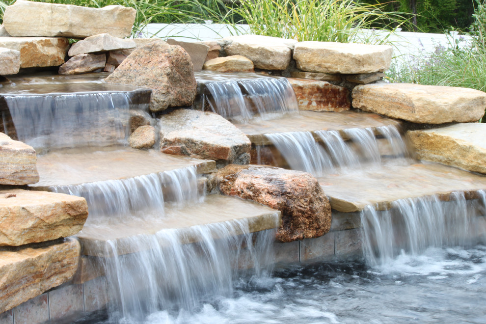Inspiration for a rustic pool remodel in Boston