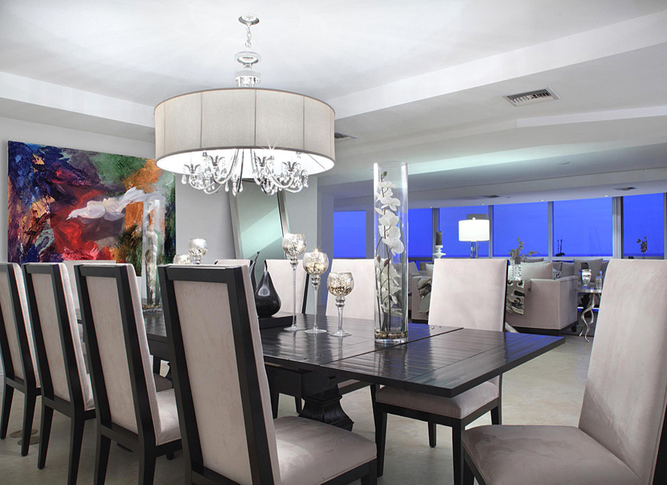 Mid-sized contemporary open plan dining in Miami with white walls, travertine floors and no fireplace.