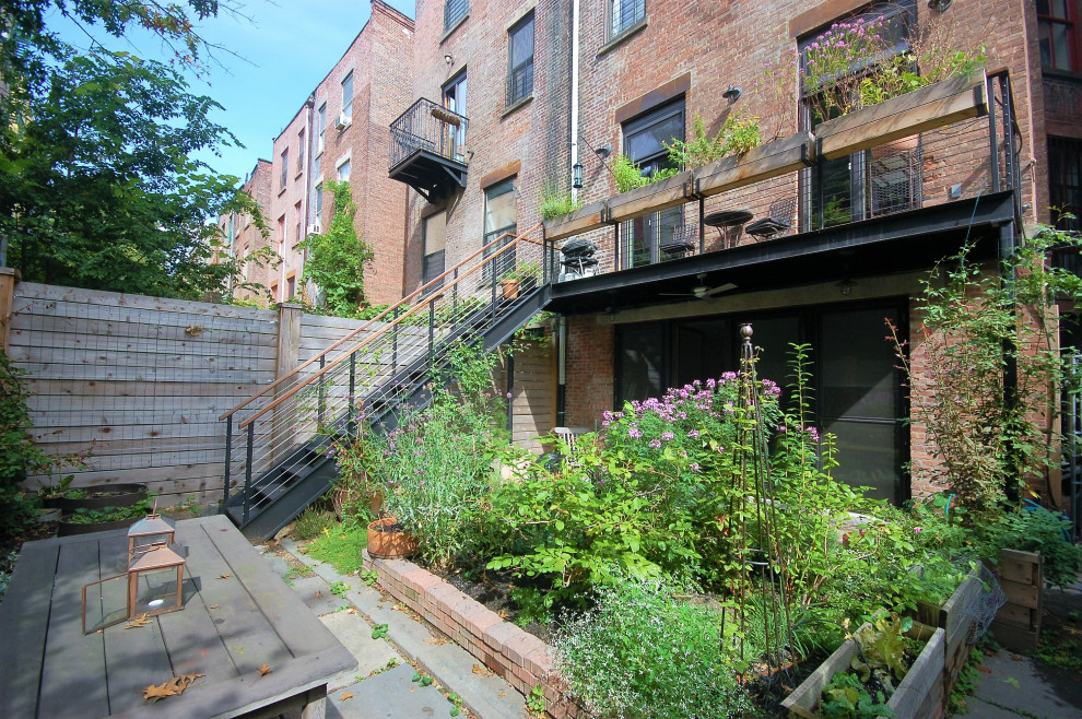 This is an example of a transitional patio in New York.