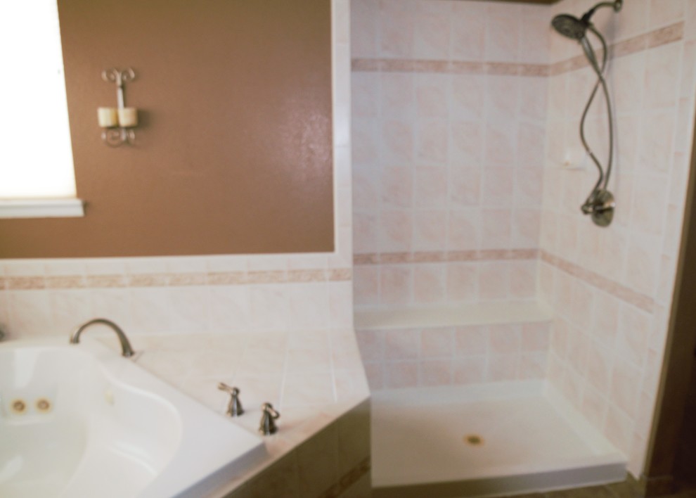 This is an example of a mid-sized transitional master bathroom in Denver with brown walls.