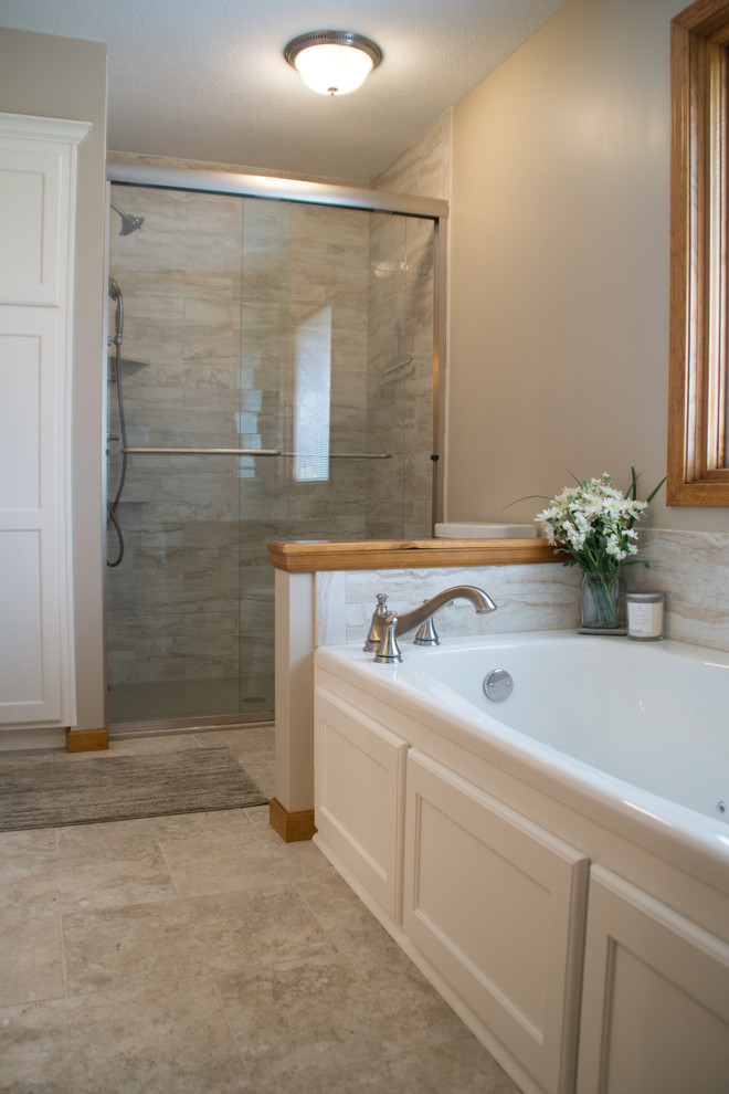Design ideas for a mid-sized traditional master bathroom in Other with recessed-panel cabinets, white cabinets, an alcove tub, an alcove shower, a two-piece toilet, beige tile, porcelain tile, grey walls, porcelain floors, an undermount sink, engineered quartz benchtops, beige floor, a sliding shower screen and white benchtops.