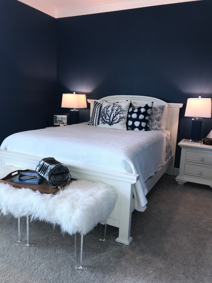 This is an example of a small transitional master bedroom in Baltimore with blue walls, carpet, no fireplace and beige floor.