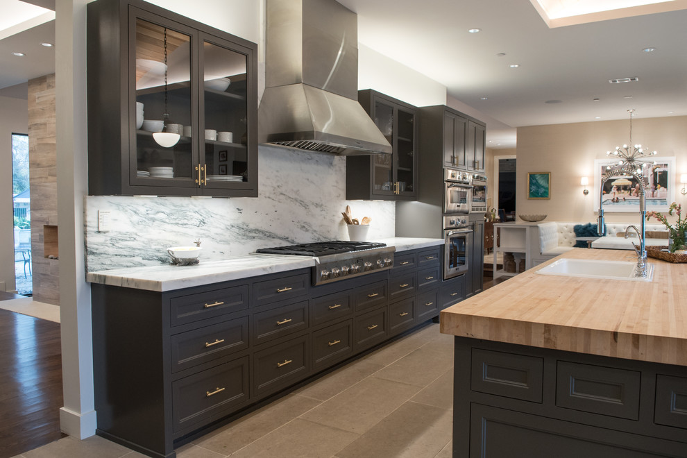 Inspiration for a large transitional galley eat-in kitchen in Dallas with a drop-in sink, beaded inset cabinets, grey cabinets, marble benchtops, white splashback, stainless steel appliances, limestone floors, with island, beige floor and stone slab splashback.