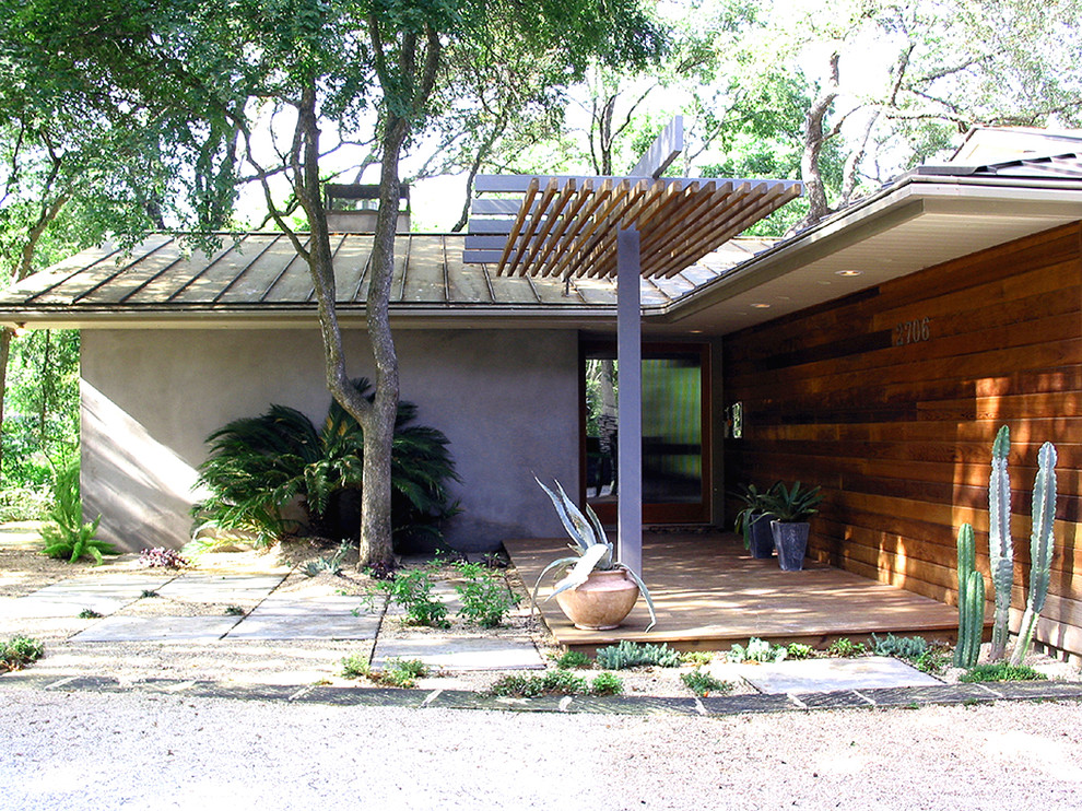 Photo of a contemporary entryway in Austin with a glass front door.