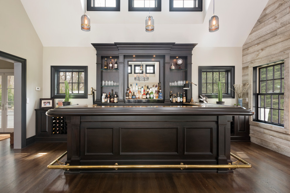 Inspiration for a mid-sized transitional u-shaped seated home bar in New York with recessed-panel cabinets, dark wood cabinets, timber splashback, medium hardwood floors, brown floor, wood benchtops and brown benchtop.
