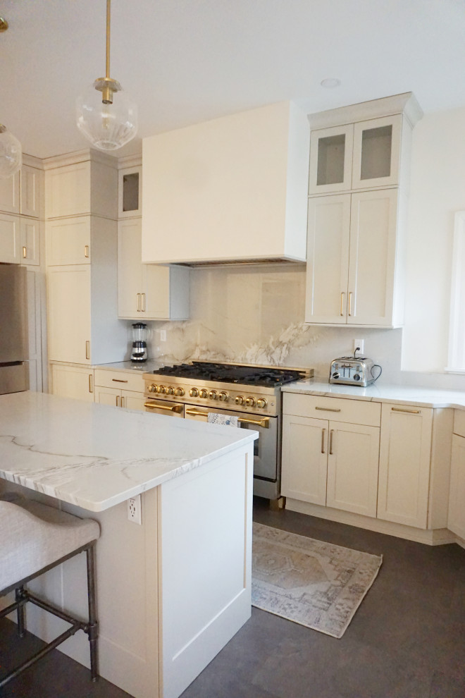 Kitchen - transitional vinyl floor and gray floor kitchen idea with an undermount sink, shaker cabinets, gray cabinets, quartzite countertops, stone slab backsplash, stainless steel appliances and an island