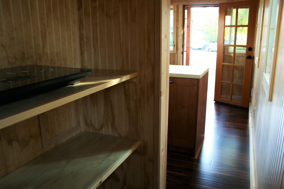 Inspiration for a small rustic dark wood floor hallway remodel in Seattle