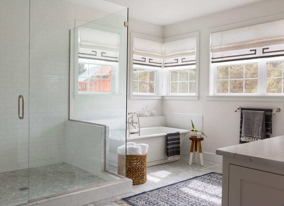 Inspiration for a transitional master bathroom in San Francisco with shaker cabinets, grey cabinets, a freestanding tub, an alcove shower, white tile, marble benchtops, grey floor, a hinged shower door and a built-in vanity.
