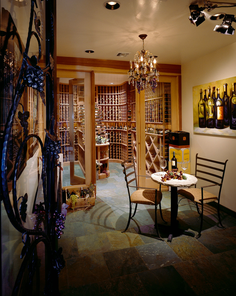 Inspiration for a mid-sized traditional wine cellar in Phoenix with storage racks, porcelain floors and brown floor.