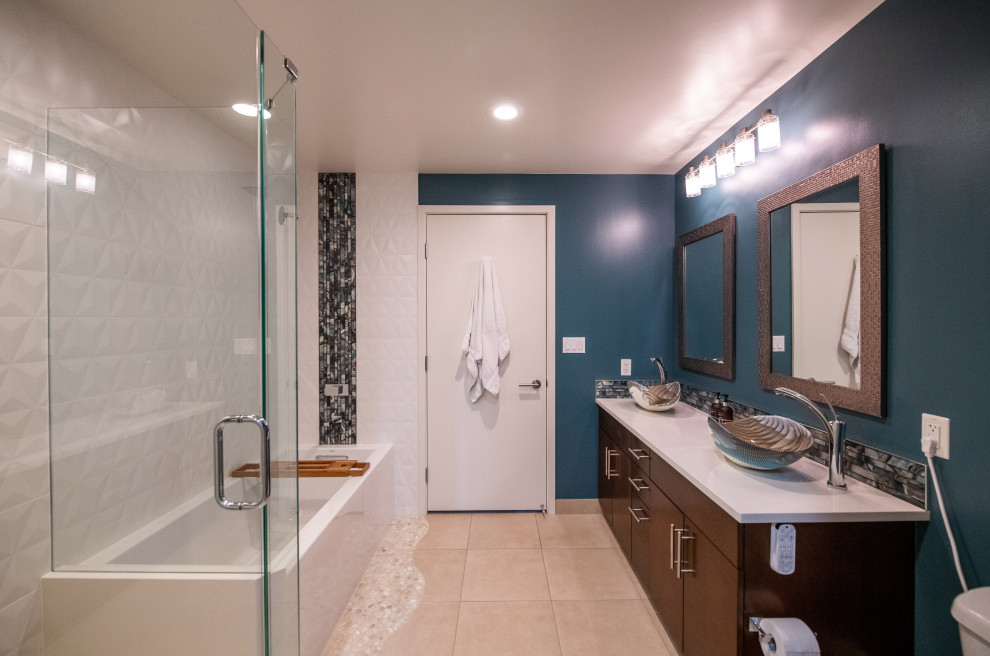This is an example of a medium sized nautical ensuite bathroom in Denver with flat-panel cabinets, brown cabinets, a built-in bath, a corner shower, a bidet, white tiles, a pedestal sink, a hinged door, white worktops, double sinks and a built in vanity unit.