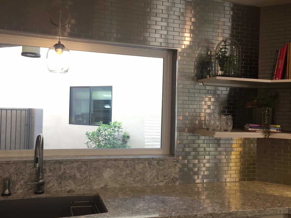 Inspiration for a transitional kitchen remodel in Phoenix with shaker cabinets, dark wood cabinets and quartz countertops