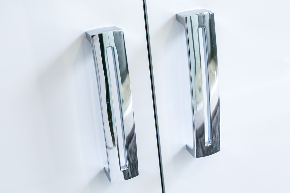 Inspiration for a transitional bathroom remodel in Miami with flat-panel cabinets and white cabinets