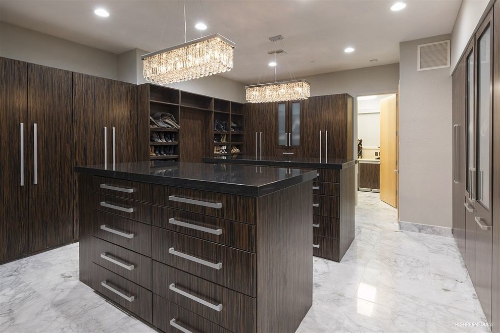 This is an example of a large contemporary gender-neutral walk-in wardrobe in Phoenix with flat-panel cabinets, dark wood cabinets, marble floors and multi-coloured floor.
