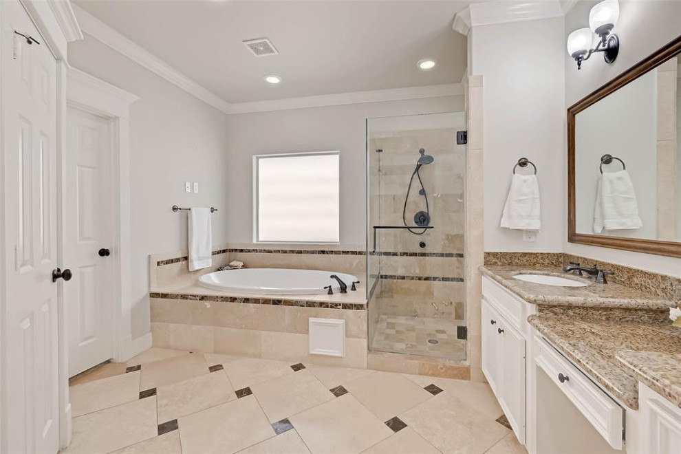 This is an example of a transitional master bathroom in Houston.