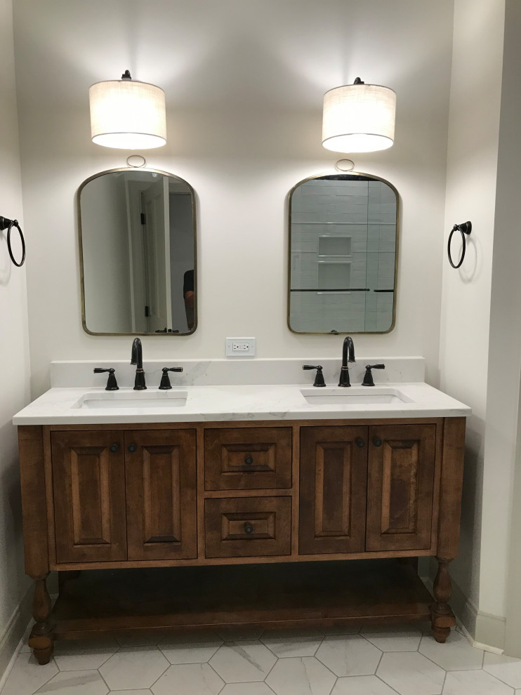 Photo of a large transitional bathroom in Other with raised-panel cabinets, light wood cabinets, an alcove tub, a corner shower, a two-piece toilet, white walls, porcelain floors, an undermount sink, engineered quartz benchtops, white floor, a sliding shower screen, white benchtops, an enclosed toilet, a double vanity, a built-in vanity and vaulted.