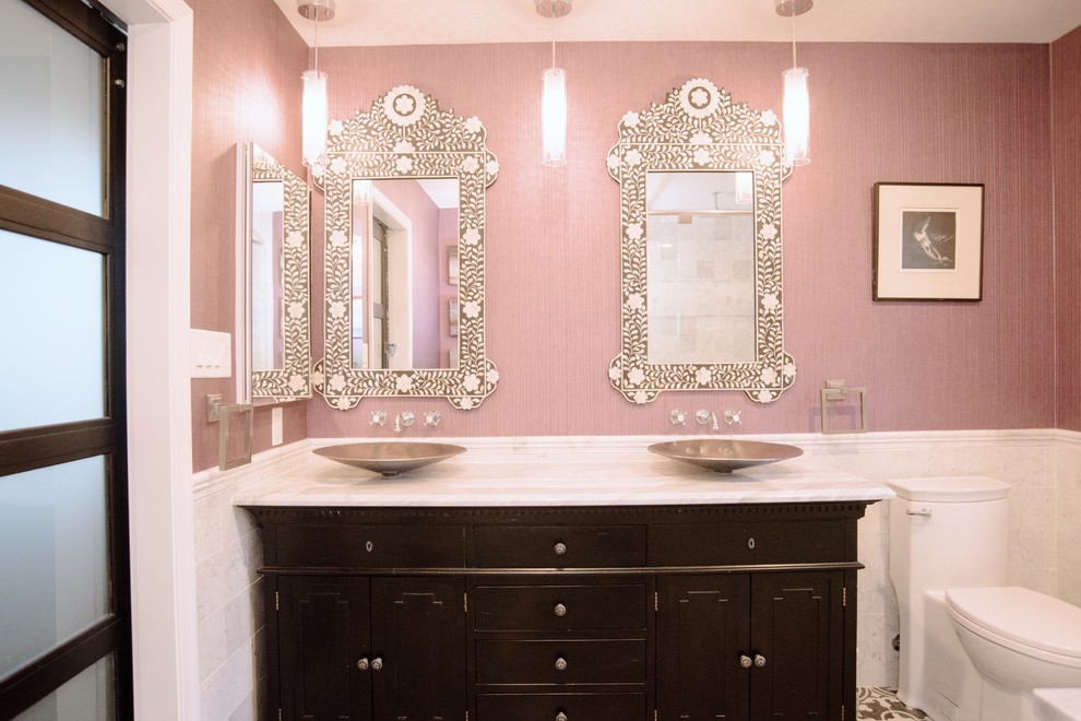 Mid-sized asian kids bathroom in DC Metro with recessed-panel cabinets, dark wood cabinets, a claw-foot tub, a shower/bathtub combo, a one-piece toilet, white tile, stone tile, pink walls, ceramic floors, a pedestal sink, granite benchtops, black floor, an open shower and white benchtops.