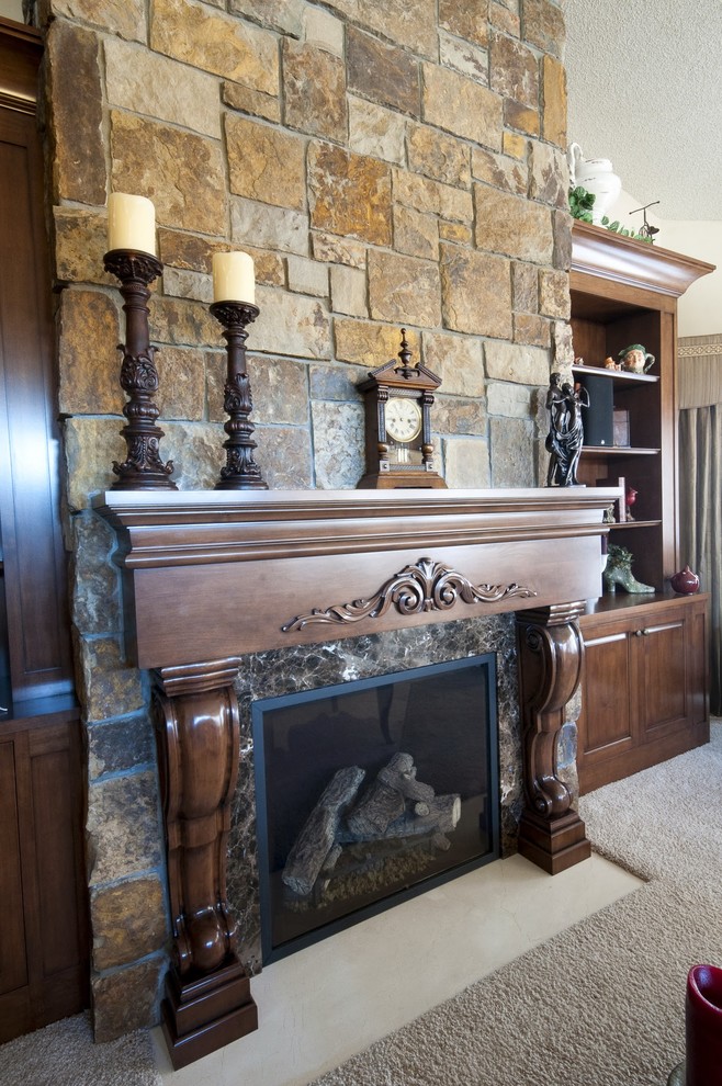Inspiration for a traditional formal open concept living room in Minneapolis with beige walls, carpet, a standard fireplace, a stone fireplace surround and no tv.